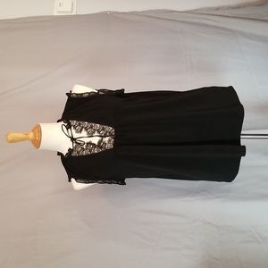 Is black express short sleeve top with lace front